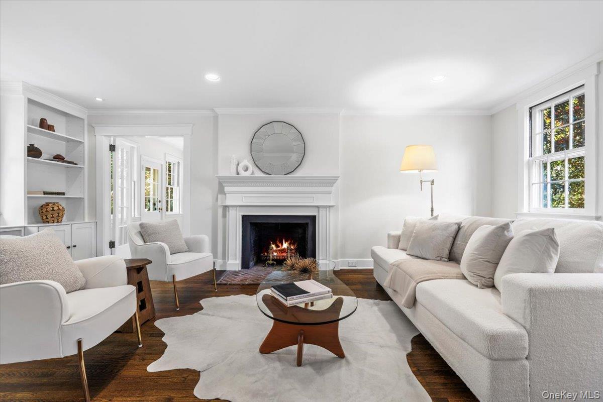 36 Intervale Place Rye, NY 10580 - Photo 6 of 41 Living room features wood burning fireplace, custom built-ins and original french doors leading to the study.
