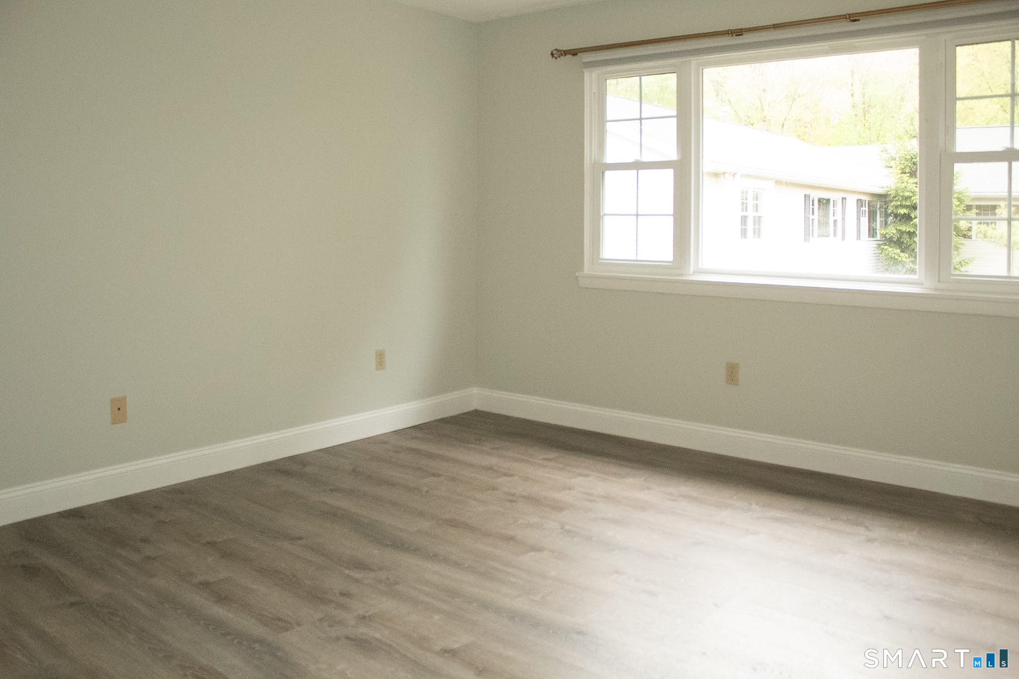 10 Georgetown Drive, Unit J Enfield, CT 06082 - Photo 10 of 15 an empty room with a window