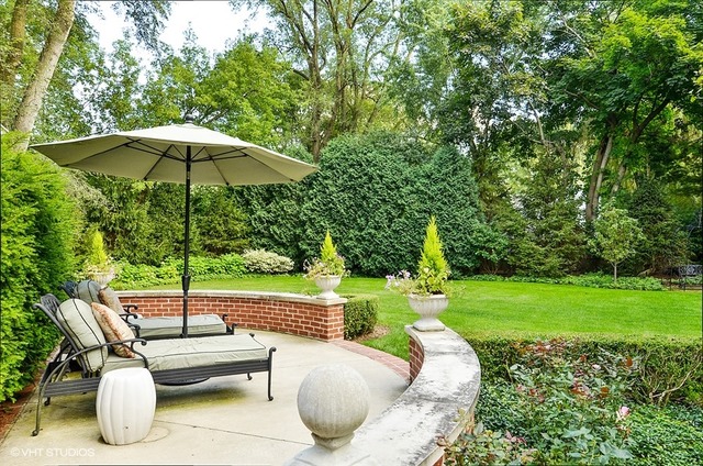 1020 Mt Pleasant Road Winnetka, IL 60093 - Photo 22 of 24 a view of a backyard with sitting area and furniture