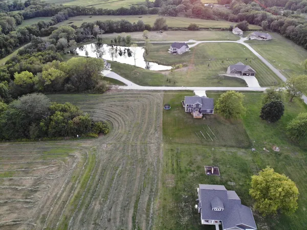 an aerial view of a house with a lake view