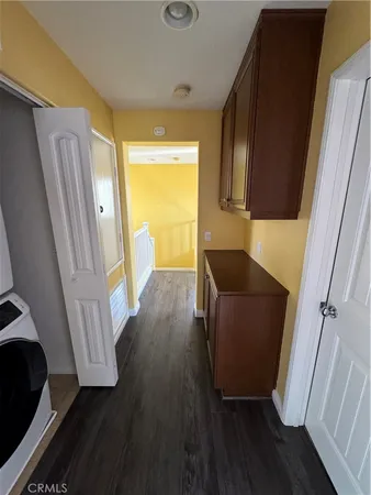 a view of front door and wooden floor