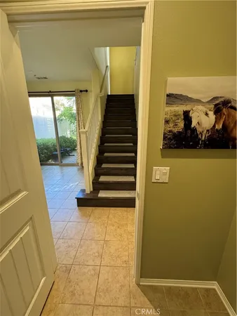 a view of entryway with furniture and wooden floor