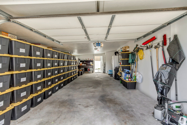 48 Moon Ridge Drive Murray, UT 84107 - Photo 21 of 30 Spacious garage featuring concrete flooring and a white paneled garage door