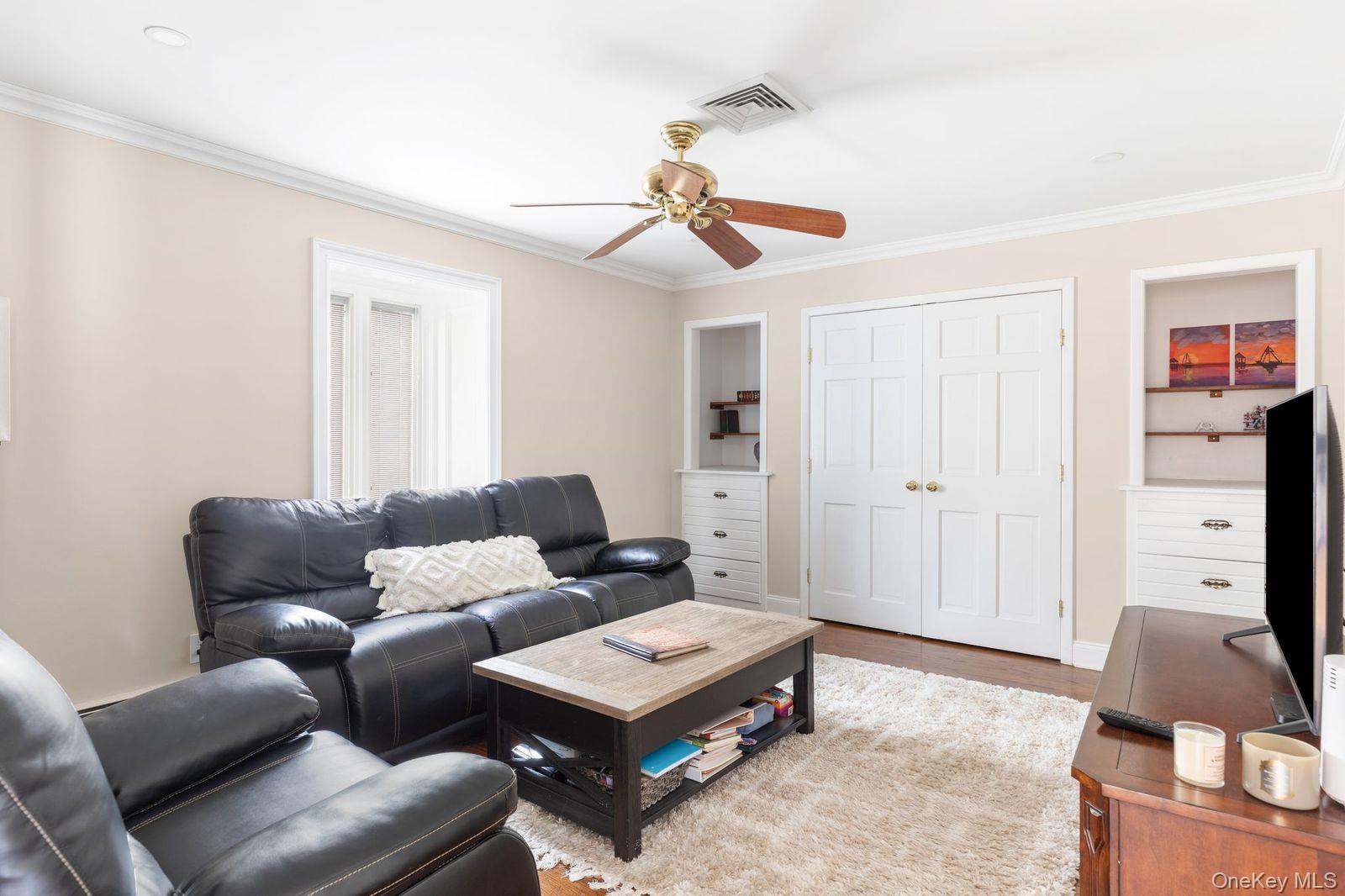 33 Beach Road Northport, NY 11768 - Photo 34 of 50 a living room with furniture a rug and a window