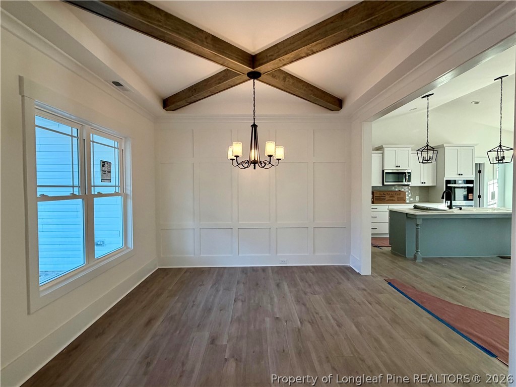 1788 Alderman Mill Road Dunn, NC 28334 - Photo 3 of 14 a view of a kitchen with wooden floor and a sink
