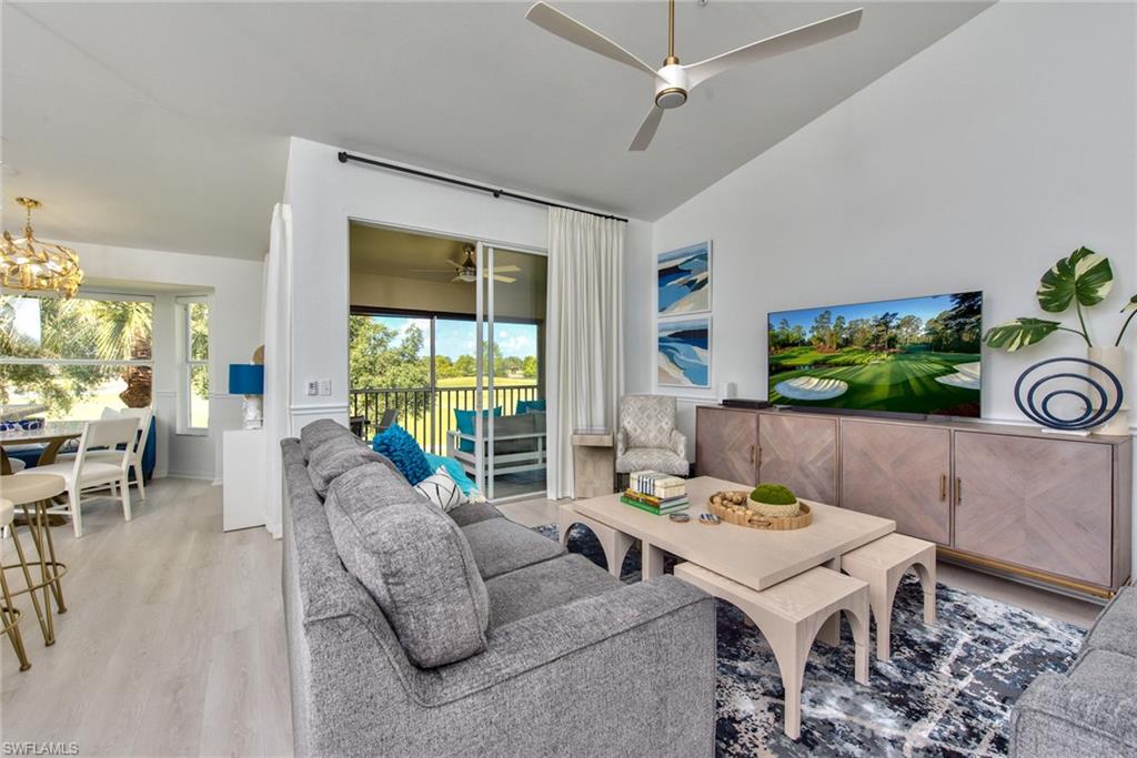 21340 Lancaster Run, Unit 1327 Estero, FL 33928 - Photo 1 of 27 a living room with furniture and a large window