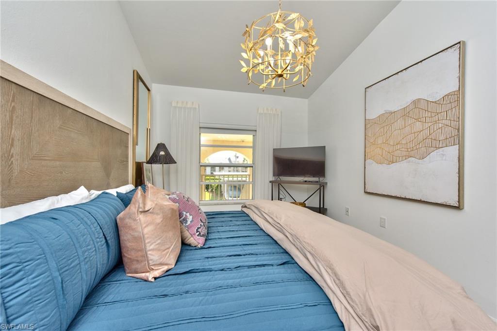21340 Lancaster Run, Unit 1327 Estero, FL 33928 - Photo 11 of 27 a living room with furniture and a flat screen tv