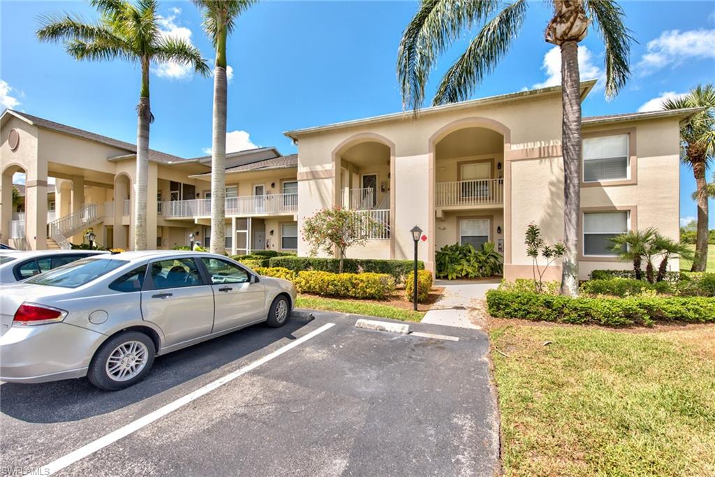 21340 Lancaster Run, Unit 1327 Estero, FL 33928 - Photo 20 of 27 a car parked in front of a building