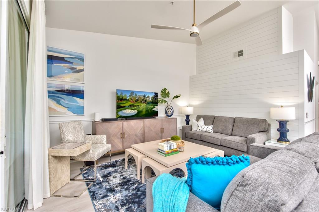 21340 Lancaster Run, Unit 1327 Estero, FL 33928 - Photo 2 of 27 a living room with furniture and a potted plant
