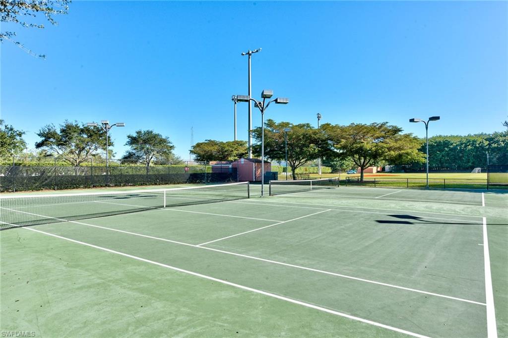 21340 Lancaster Run, Unit 1327 Estero, FL 33928 - Photo 25 of 27 a view of a tennis court