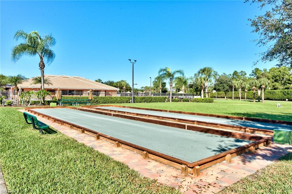 21340 Lancaster Run, Unit 1327 Estero, FL 33928 - Photo 27 of 27 a view of a swimming pool and a yard