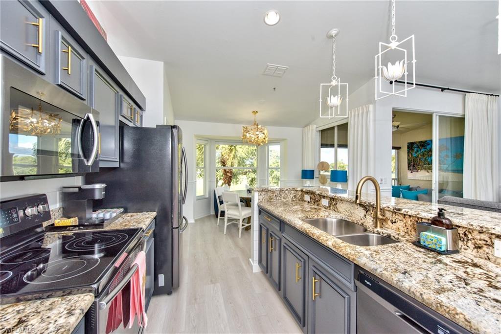 21340 Lancaster Run, Unit 1327 Estero, FL 33928 - Photo 7 of 27 a kitchen with granite countertop lots of counter top space