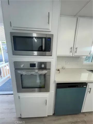 a kitchen with a stove and a microwave