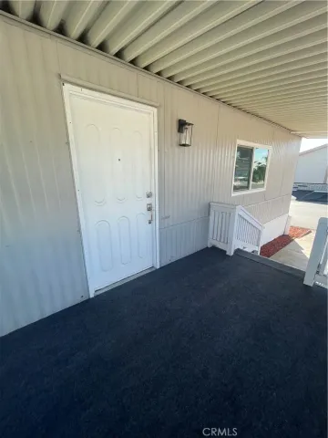 a view of livingroom and hardwood floor