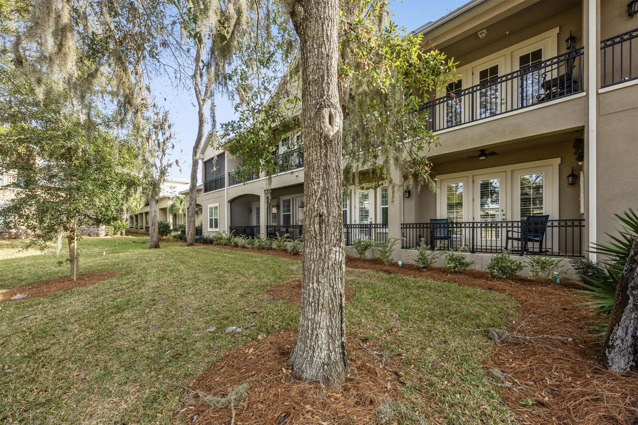 95049 Summer Crossing Road, Unit 1502 Fernandina Beach, FL 32034 - Photo 43 of 61 a front view of a house with a yard