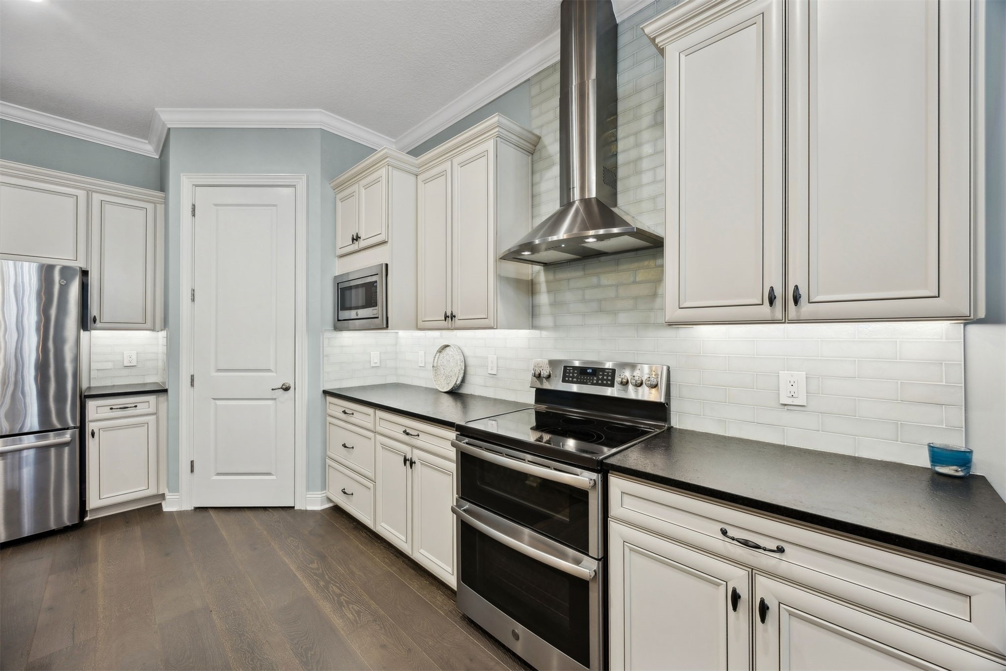 95049 Summer Crossing Road, Unit 1502 Fernandina Beach, FL 32034 - Photo 5 of 61 a kitchen with stainless steel appliances granite countertop a refrigerator and a stove