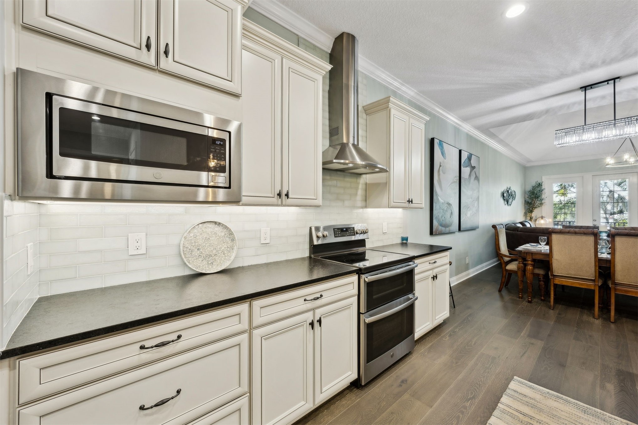 95049 Summer Crossing Road, Unit 1502 Fernandina Beach, FL 32034 - Photo 6 of 61 a kitchen with granite countertop stainless steel appliances a stove microwave and cabinets