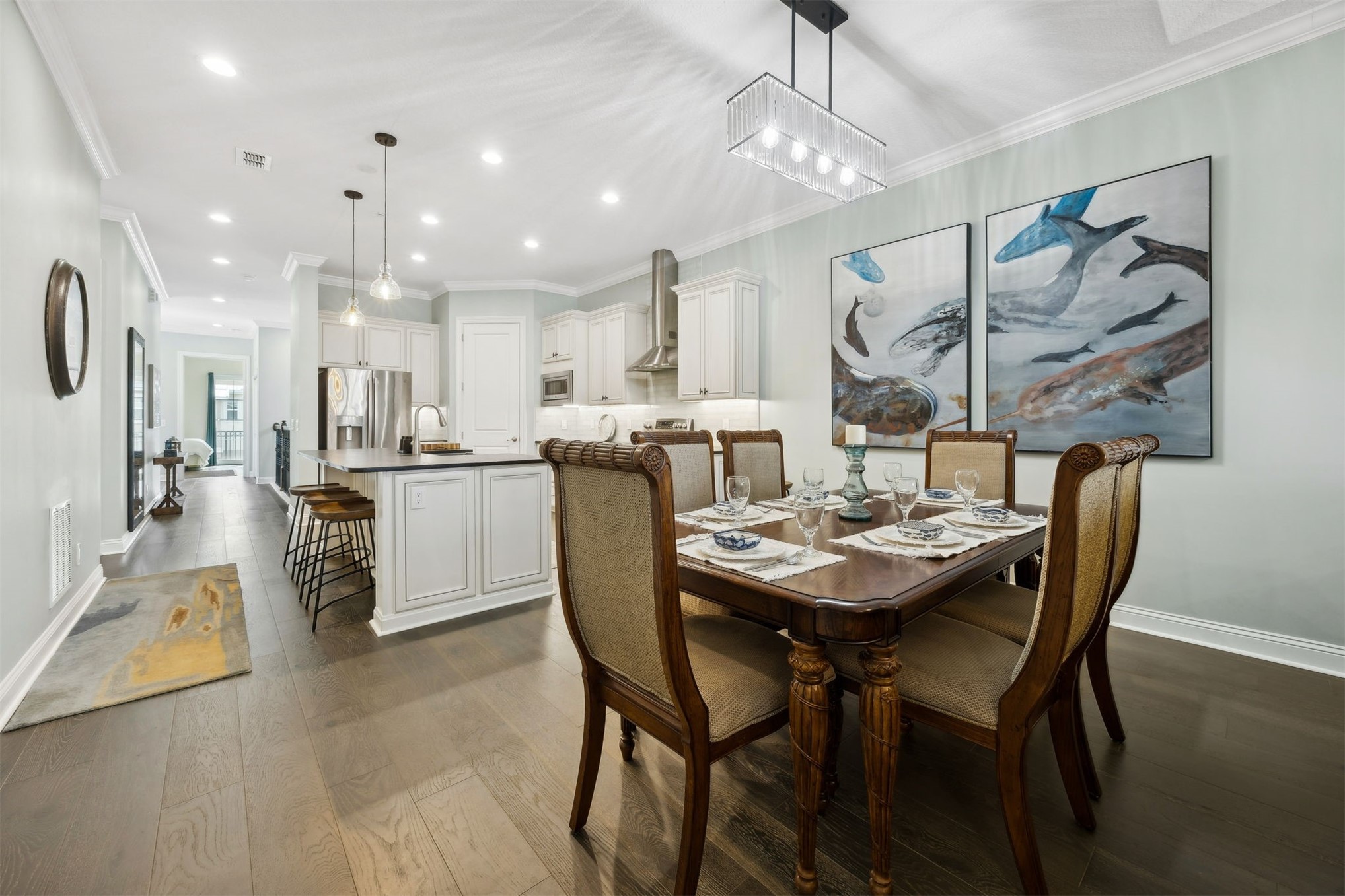 95049 Summer Crossing Road, Unit 1502 Fernandina Beach, FL 32034 - Photo 9 of 61 a dining room with stainless steel appliances kitchen island a table and chairs