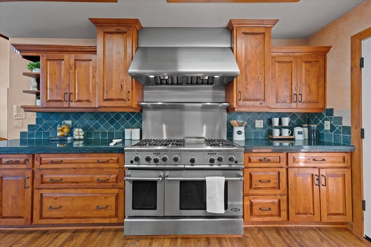 16000 Southridge Road Penn Valley, CA 95946 - Photo 15 of 75 a kitchen with granite countertop a stove top oven cabinetry and granite counter top