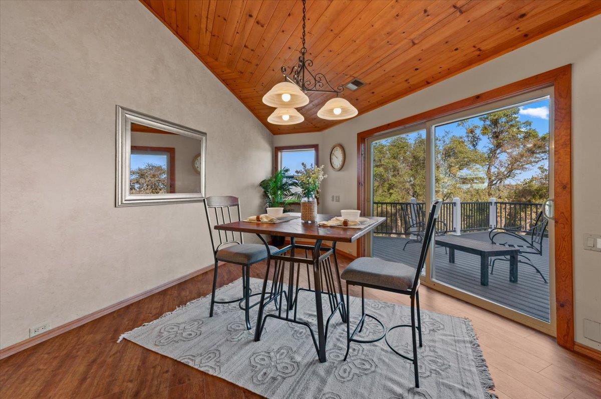 16000 Southridge Road Penn Valley, CA 95946 - Photo 17 of 75 a view of a dining room with furniture window and wooden floor