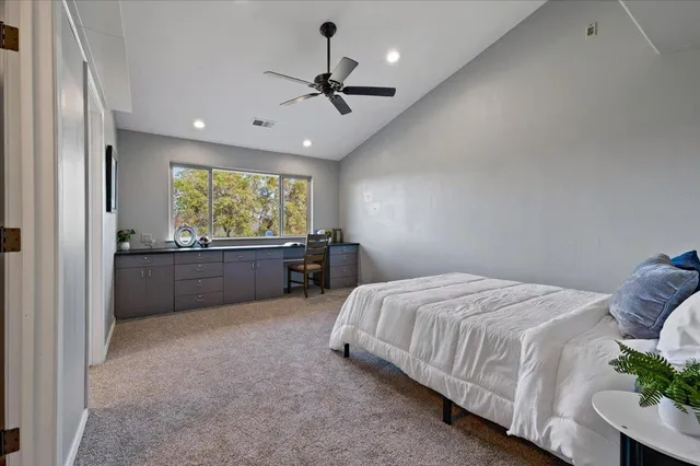 a dining room with furniture a chandelier and wooden floor