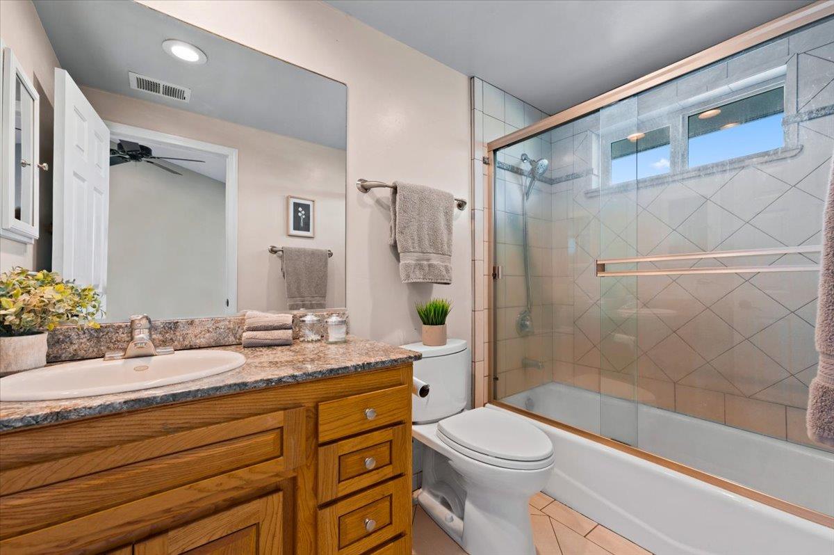 16000 Southridge Road Penn Valley, CA 95946 - Photo 22 of 75 a bathroom with a granite countertop sink toilet and shower