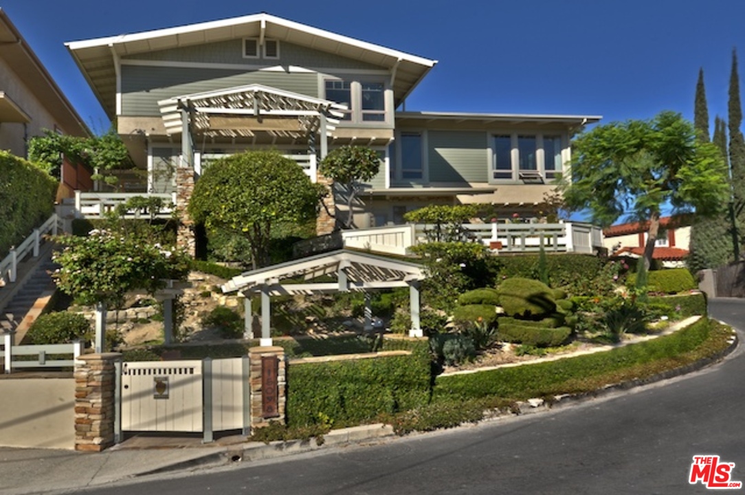 15098 Rayneta Drive Sherman Oaks, CA 91403 - Photo 1 of 51 a front view of a house with a yard