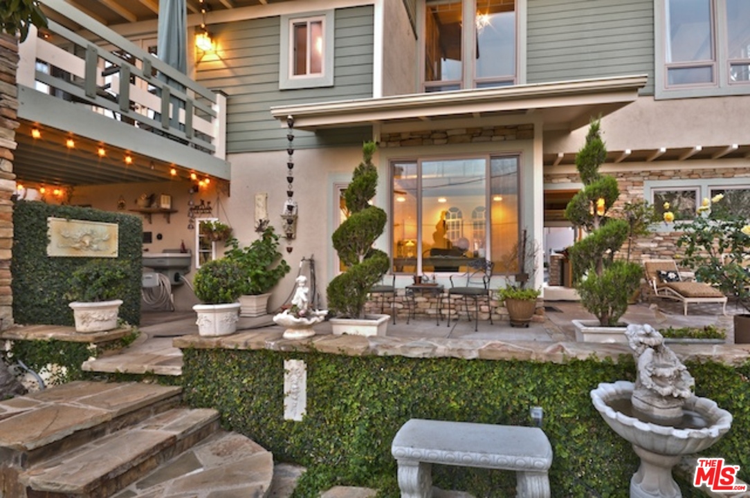15098 Rayneta Drive Sherman Oaks, CA 91403 - Photo 13 of 51 a view of a patio with chairs and plants