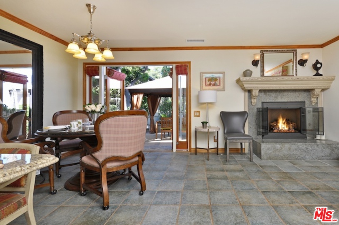 15098 Rayneta Drive Sherman Oaks, CA 91403 - Photo 18 of 51 a living room with furniture a window and a fireplace