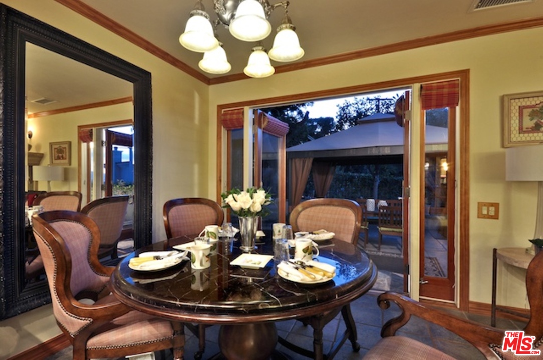 15098 Rayneta Drive Sherman Oaks, CA 91403 - Photo 20 of 51 a view of a dining room with furniture and wooden floor