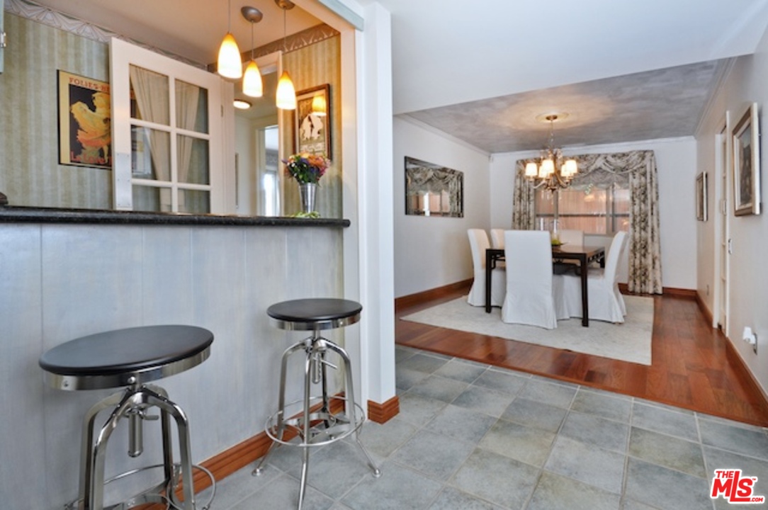 15098 Rayneta Drive Sherman Oaks, CA 91403 - Photo 21 of 51 a view of a livingroom with furniture and a window