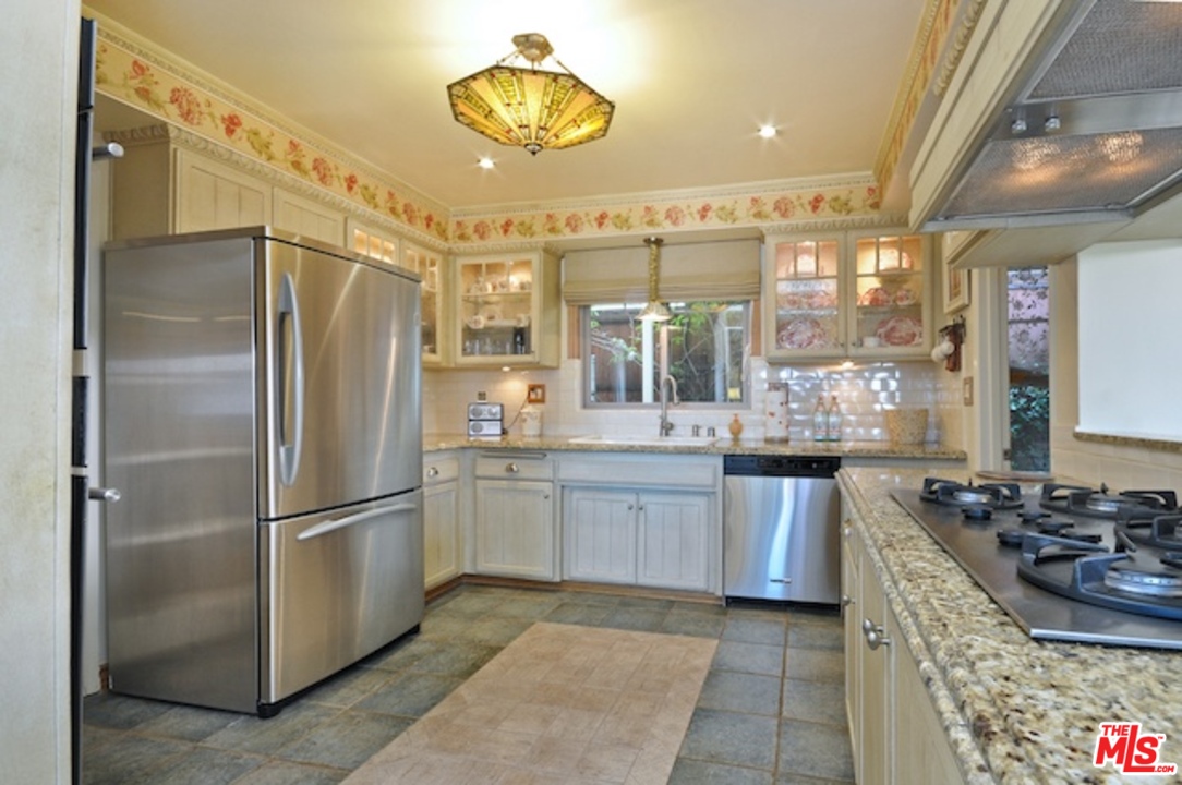15098 Rayneta Drive Sherman Oaks, CA 91403 - Photo 23 of 51 a kitchen with a refrigerator and a sink