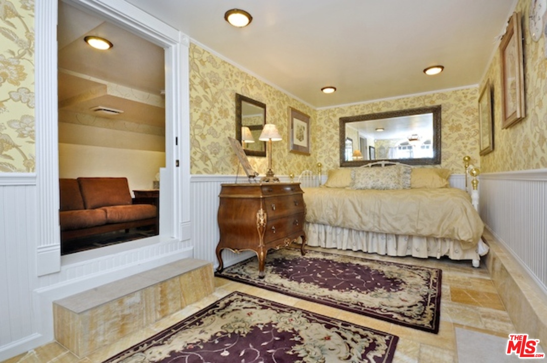 15098 Rayneta Drive Sherman Oaks, CA 91403 - Photo 47 of 51 a living room with furniture and a flat screen tv