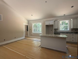14502 Gatewood Road Dewitt, VA 23840 - Photo 8 of 32 an empty room with windows and cabinet