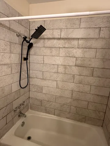 a bathroom with a shower and a bathtub
