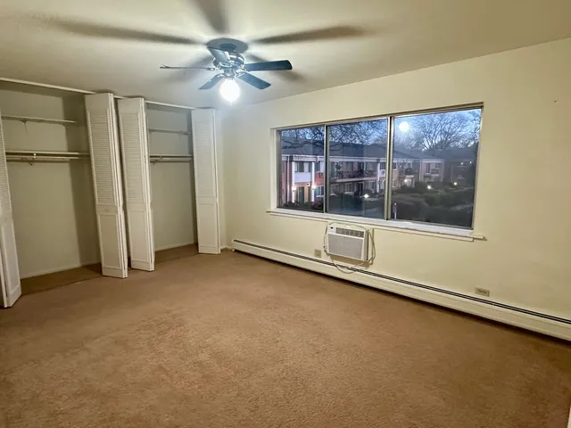 an empty room with a empty space and windows