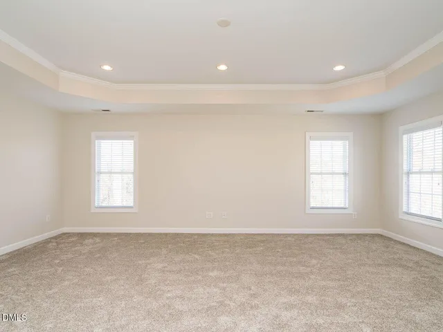 a large kitchen with stainless steel appliances a sink and cabinets