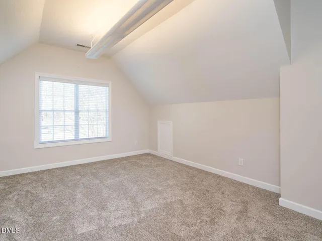 an empty room with staircase