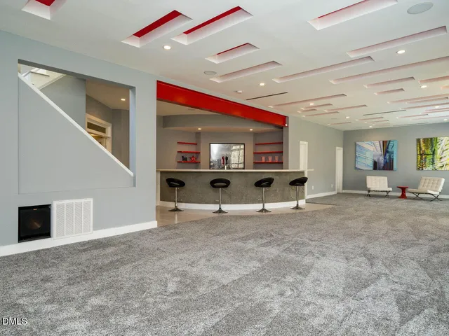 a kitchen with a sink and a wooden floor