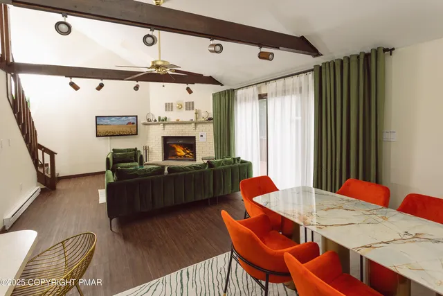 a bedroom with furniture and a fireplace