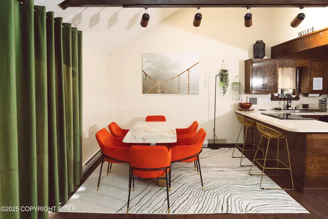 a kitchen with a sink a refrigerator and cabinets