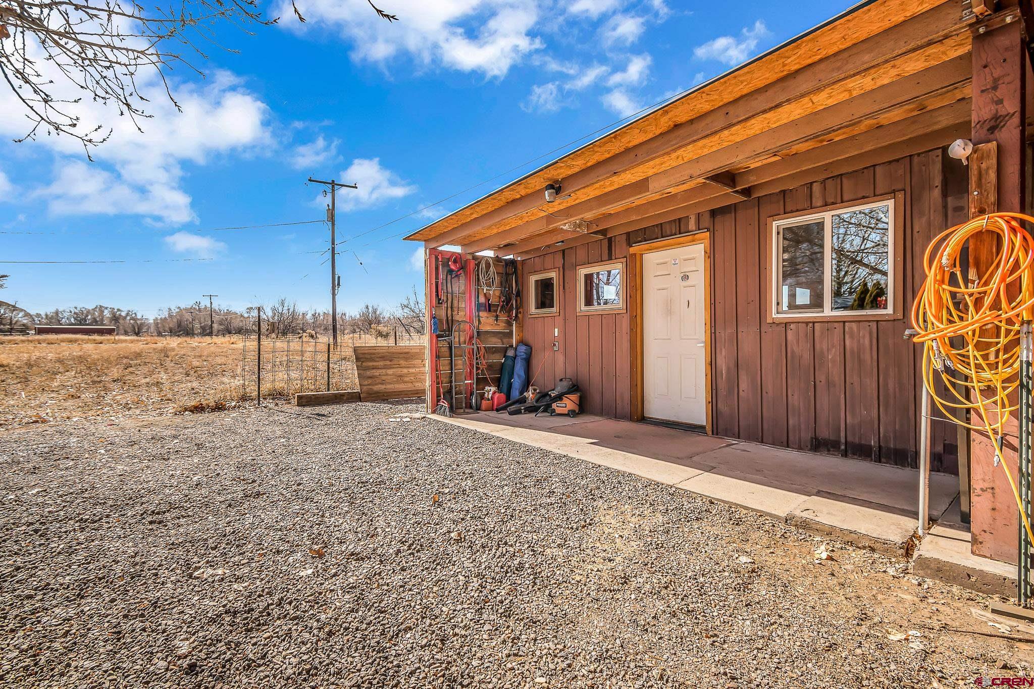 15098 6160th Road Montrose, CO 81403 - Photo 15 of 30 a backyard of a house