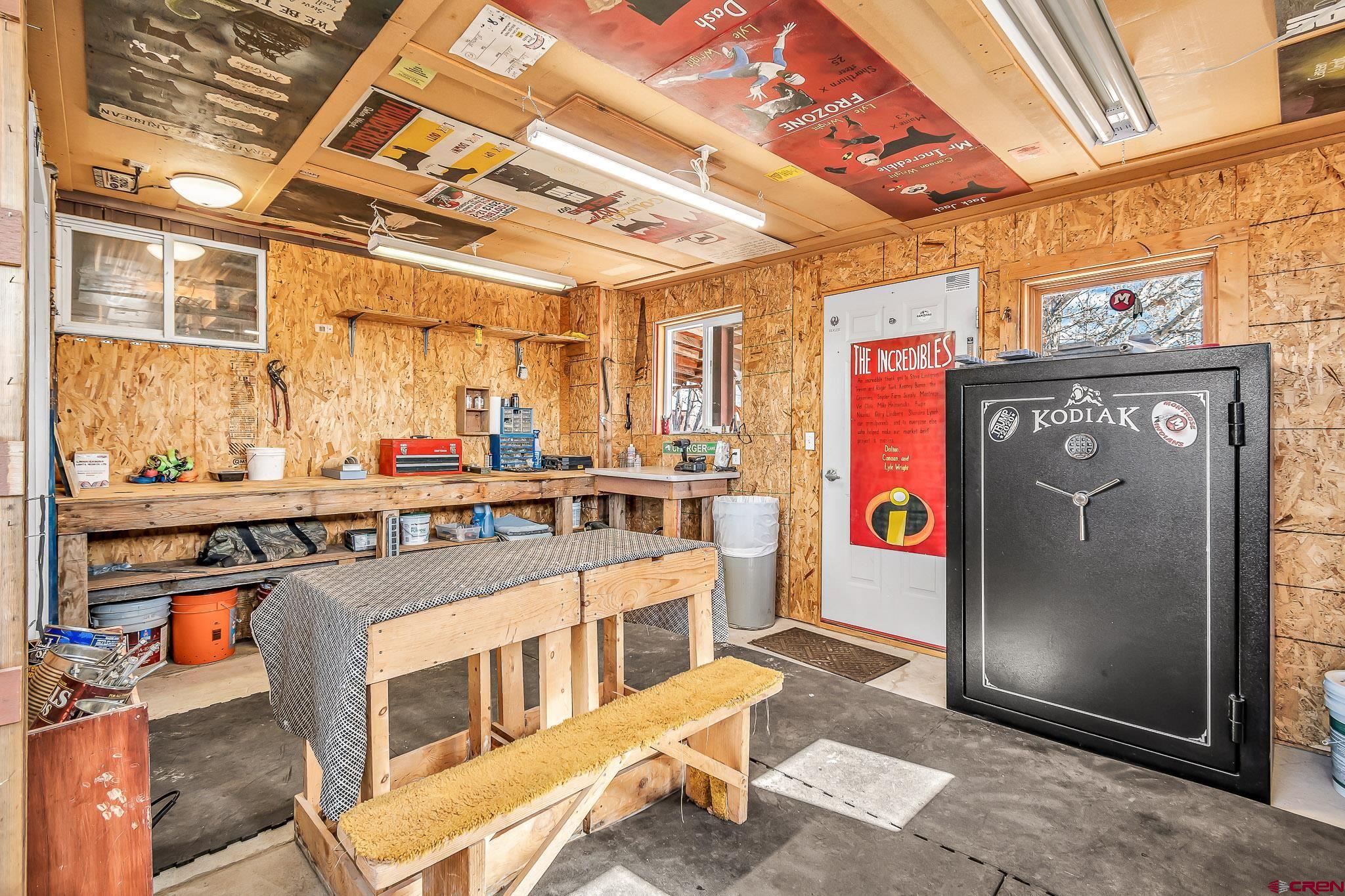 15098 6160th Road Montrose, CO 81403 - Photo 17 of 30 a kitchen with stainless steel appliances granite countertop a refrigerator and wooden cabinets