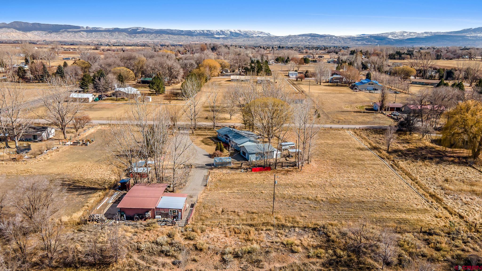 15098 6160th Road Montrose, CO 81403 - Photo 29 of 30 an aerial view of a house with a yard