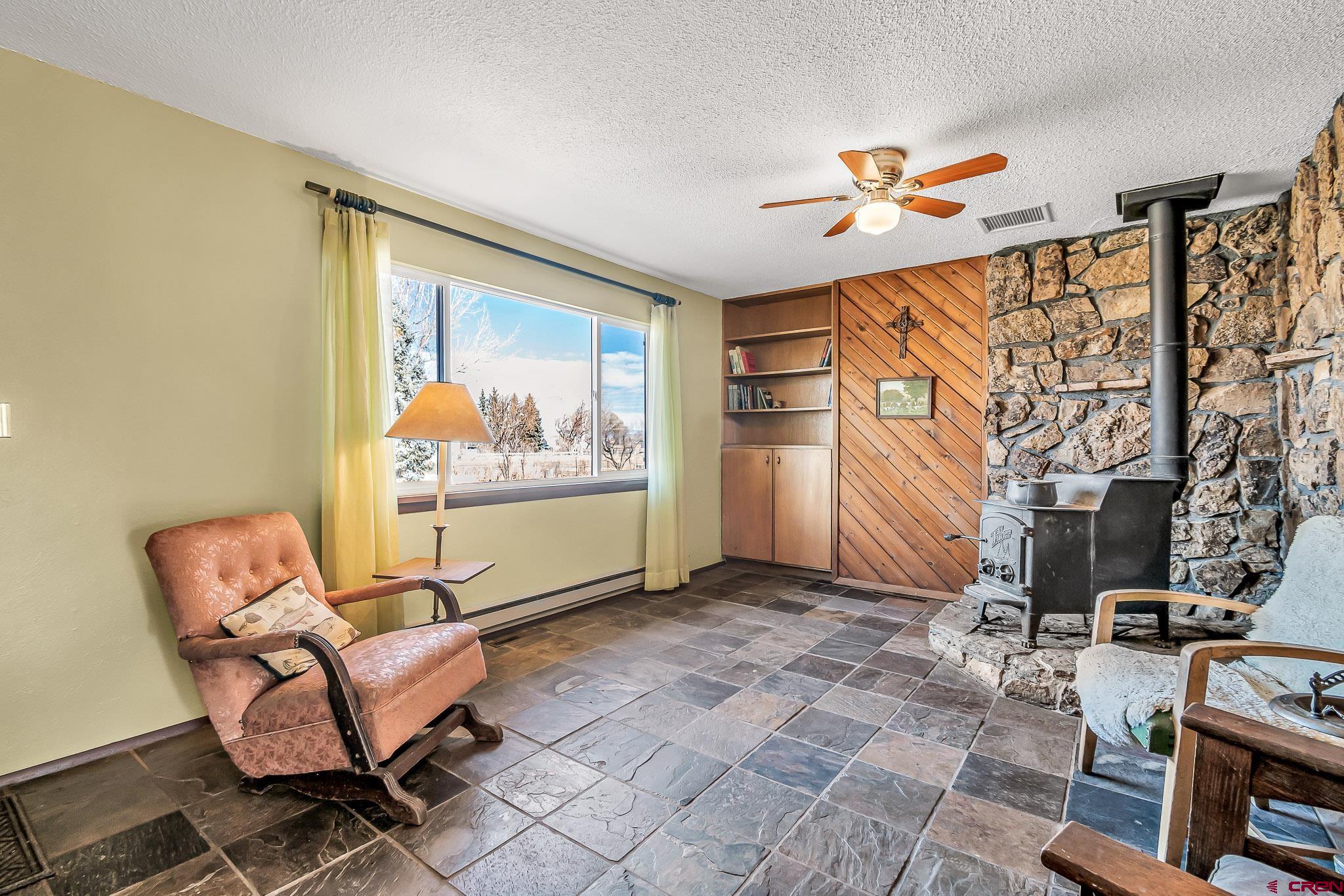 15098 6160th Road Montrose, CO 81403 - Photo 4 of 30 a bedroom with furniture and a window