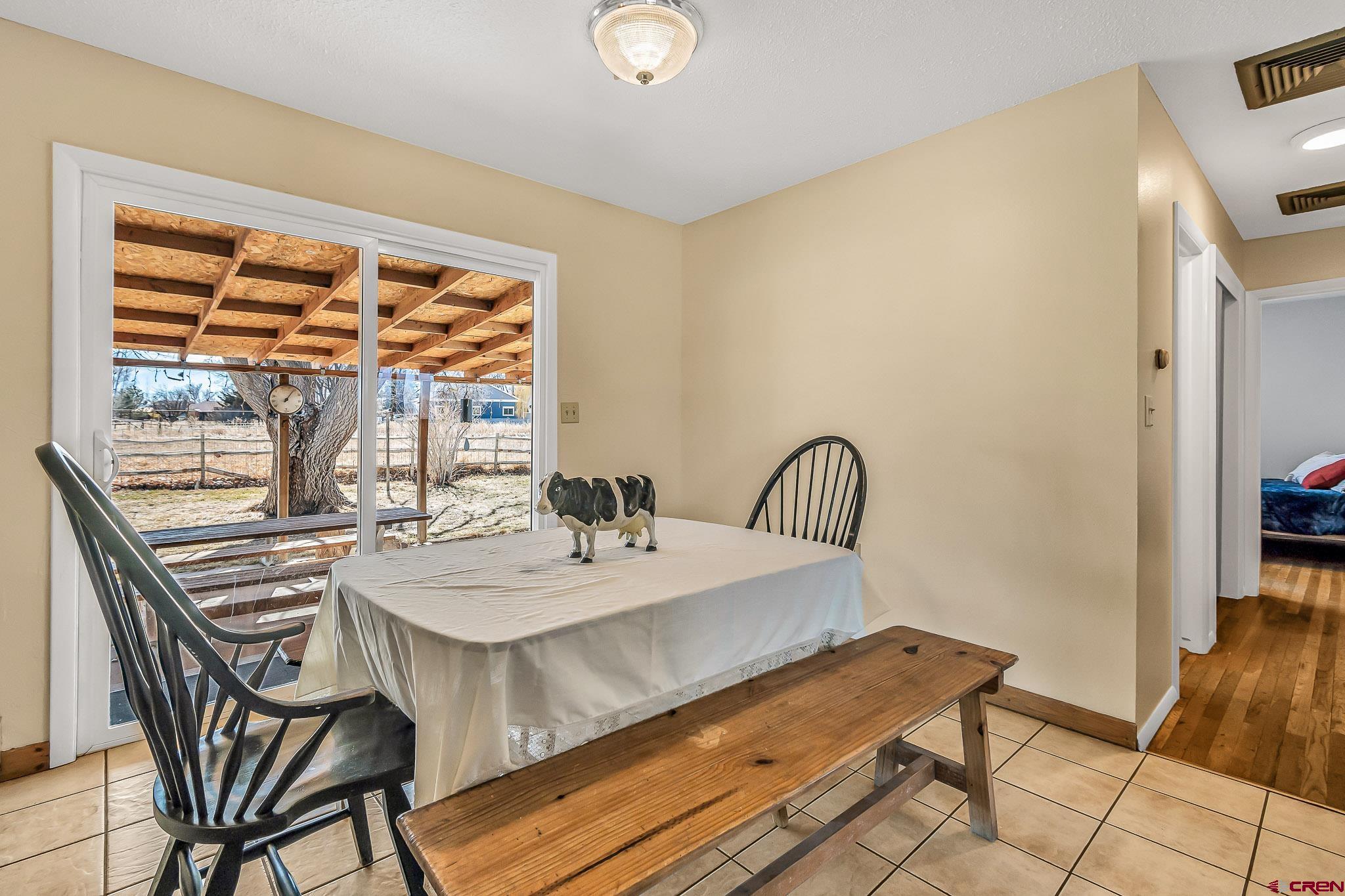15098 6160th Road Montrose, CO 81403 - Photo 6 of 30 a view of a dining room with furniture and window