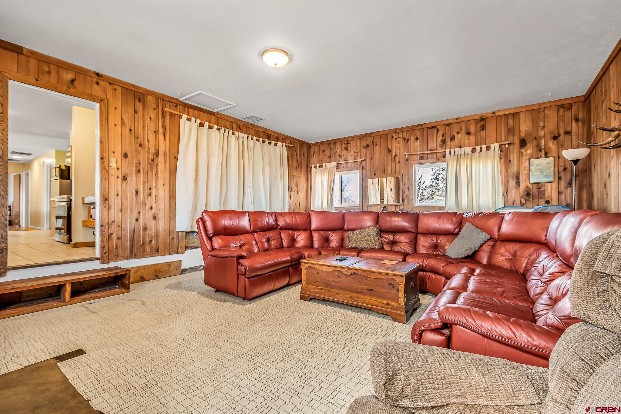 15098 6160th Road Montrose, CO 81403 - Photo 10 of 30 a living room with furniture and a large window