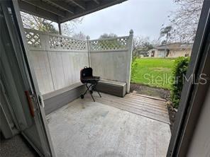 1695 Lee Road, Unit C110 Winter Park, FL 32789 - Photo 12 of 12 a view of a porch with furniture and floor to ceiling window