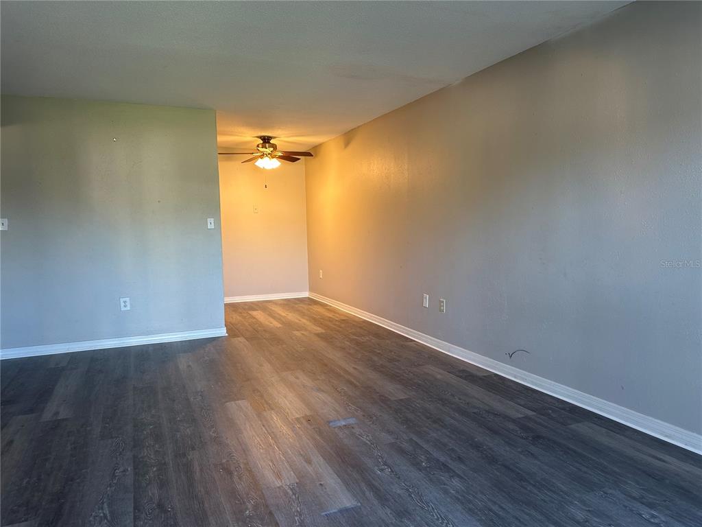 1695 Lee Road, Unit C110 Winter Park, FL 32789 - Photo 4 of 16 a view of an empty room with wooden floor