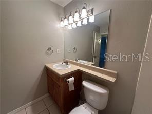 1695 Lee Road, Unit C110 Winter Park, FL 32789 - Photo 8 of 12 a bathroom with a toilet sink and mirror